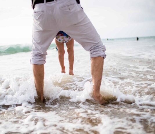 Why Does The Beach Help Anxiety? People In Sea Against Sky